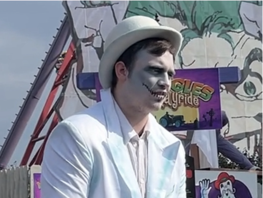 An actor at Six Flags St. Louis prepares to scare a visitor. 